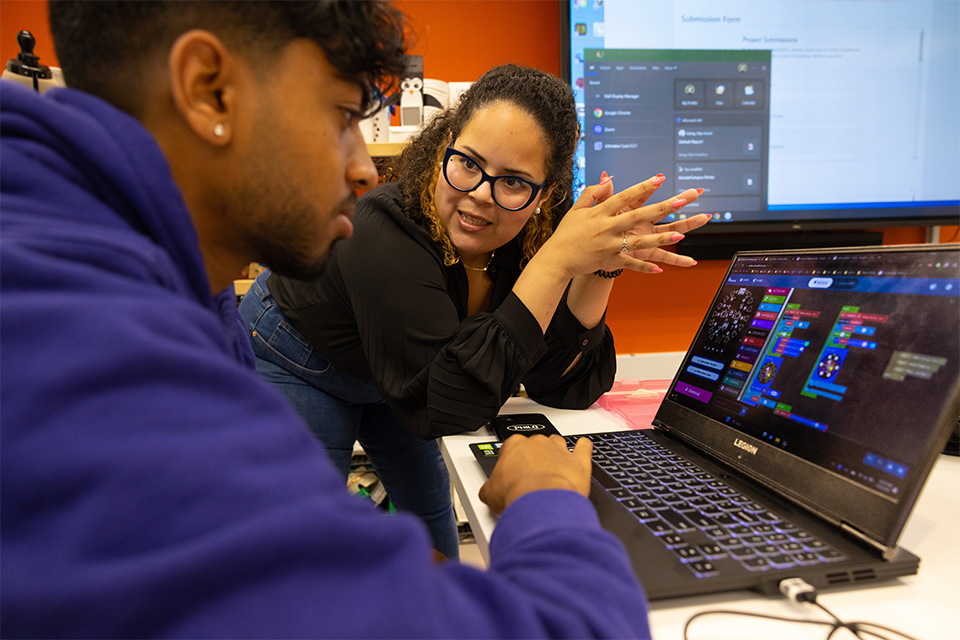 Professor Lorena Lopez, right, works with Nandha Ravi, a 4th-year architecture student  during a class where students  are developing and creating wearable technology.  