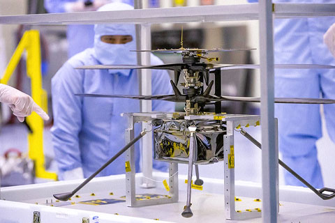   NASA engineers test the Ingenuity helicopter and its cruise stage in the airlock inside Kennedy Space Center’s Payload Hazardous Servicing Facility on March 10, 2020. Photo: NASA