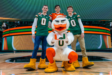 From left, Michael O’Reilly, Devin Gialleonardo, and Ethan Hartz surprised their classmates during commencement by revealing they were Sebastian the Ibis during college. Photo: David Paula/University of Miami